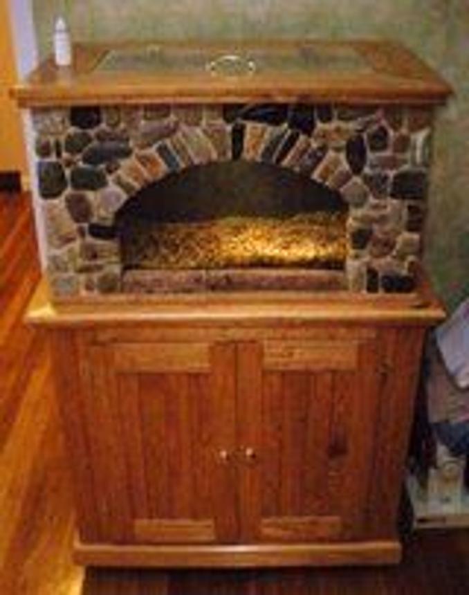 20 gallons freshwater fish tank (mostly fish and non-living decorations) - stone housing for a 20 gallon fish tank with custom cabinet and top